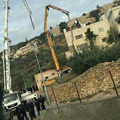 Alaa Abu Jamal's home being sealed off.