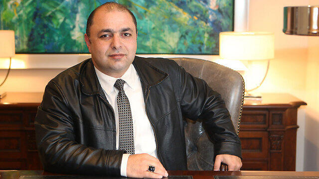 Mazen Qaq, head of the merchants' committee in Jerusalem's Old City, has offered NIS 40,000 to whoever provides information that could lead to the capture of suspected Tel Aviv shooter Nashat Melhem (Photo: Alex Kolomoisky)