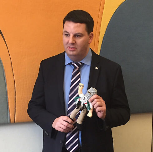 British MP Andrew Percy holding an "incitement doll" nullnull British MP Andrew Percy holding an "incitement doll"