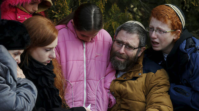 Natan Meir, Dafna's widower, with their children (Photo: Reuters)