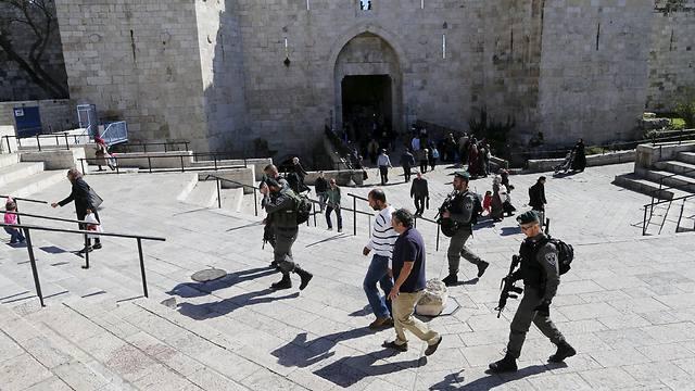 Washington Post reporters William Booth and Sufian Taha being escorted to a police station near Damascus Gate (Photo:Reuters)