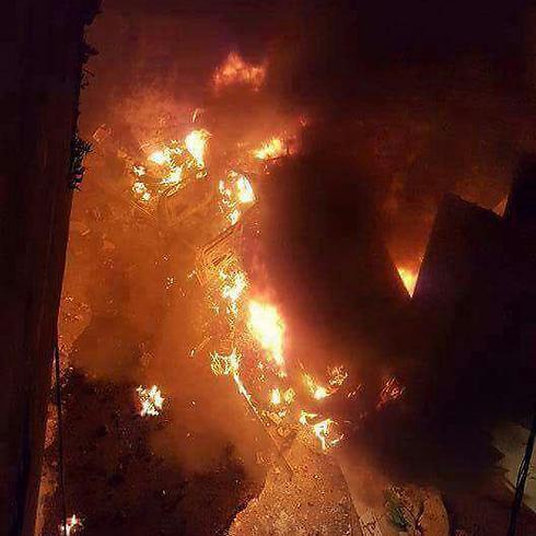 The soldiers' vehicle burning in the camp