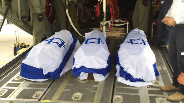 Coffins of the three murdered Israelis on the plane before returning to Israel