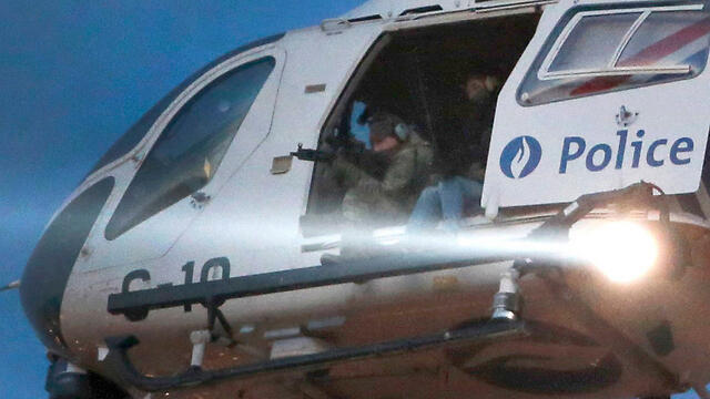 Police helicopter in manhunt for terrorist at large (צילום: רויטרס) Police helicopter in manhunt for terrorist at large