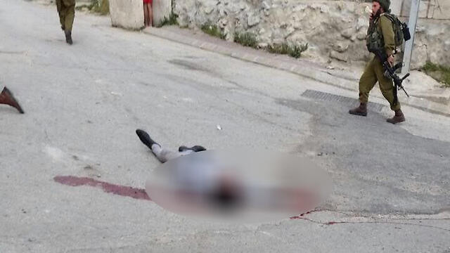 One of the terrorists neutralized at the scene of the attack.nullnull One of the terrorists neutralized at the scene of the attack.