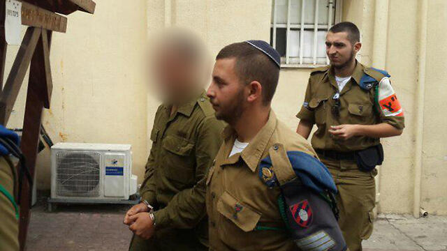 The soldier, left (Photo: Yoav Zitun)