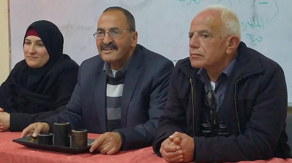 Mohammad Aliyan speaks at a convocation at the Jabel Mukaber Elementary School