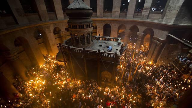 Roman Catholics and Protestants marking Easter last year in the Church of the Holy Sepulchre