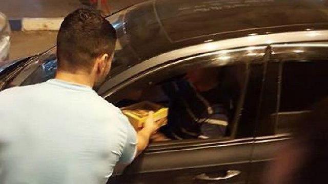 Palestinians in Tulkarem handing out cakes and cookies to celebrate the terror attack in Tel Aviv