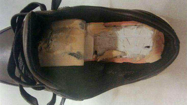 Shoe fitted to hide money in.nullnull Shoe fitted to hide money in.