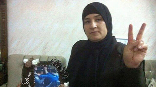 Family members posing with the cake