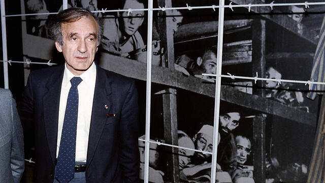 Elie Wiesel in 1986 photographed by a picture in which he can be seen in Buchenwald B concentration camp in Germany (Photo: AFP)