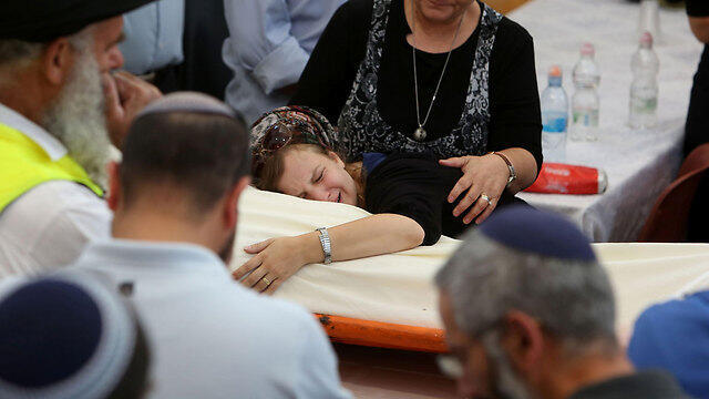 Miki Mark's funeral, Sunday. (Photo: AFP)