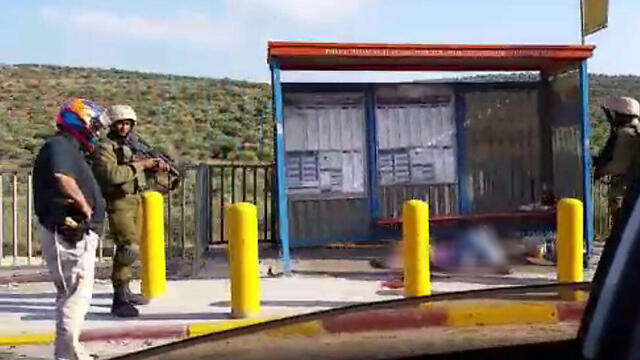 The shot attacker at the bus stop (Photo: Dina Cohen)