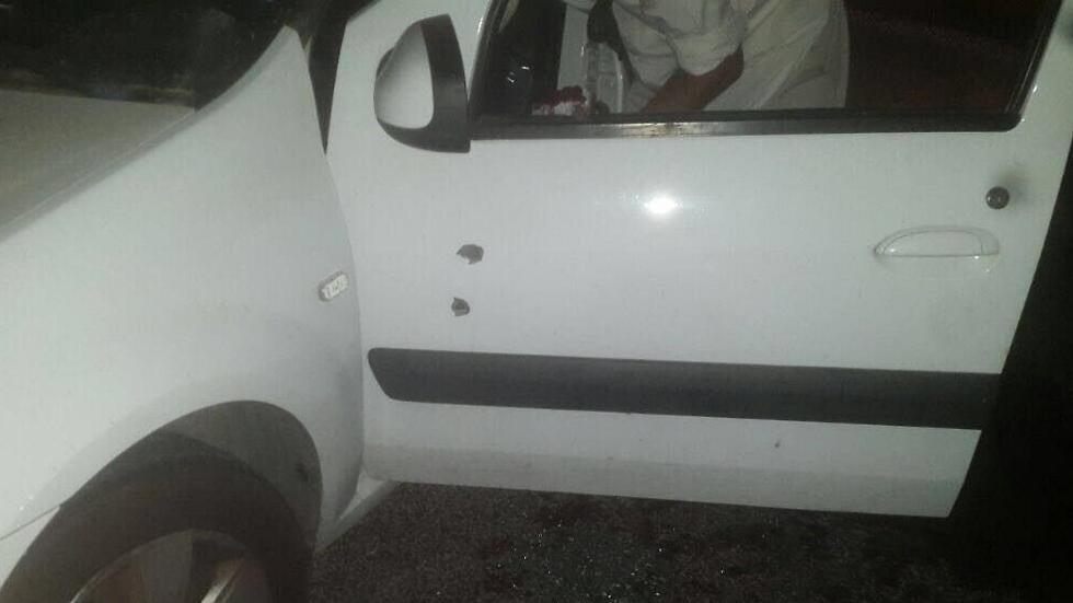 The car and bullet holes from the terrorist