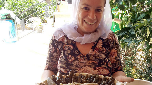 Ibtisam Fares serves breakfast. (Linda Gradstein/The Media Line) Ibtisam Fares serves breakfast.