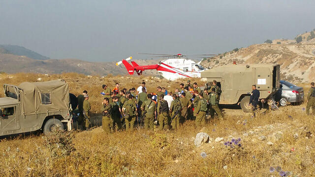 Injured soldiers are evacuated from the scene