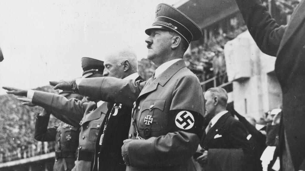 Hitler gives the Nazi salute at the opening of the 1936 Berlin Games 