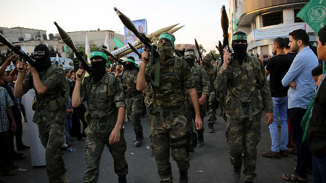 Hamas fighters on parade hours after rocket attack (Photo: AP)