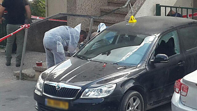 Crime scene investigators at the scene of the shooting 