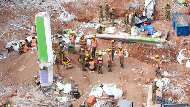 Rescuers at the crash site (Photo: Dana Kopel)