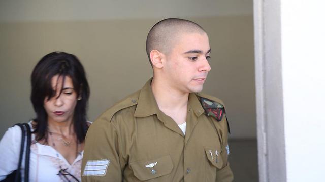 Sgt. Azaria and his mother Oshra at court (Photo: Motti Kimchi)