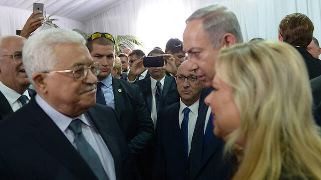Benjamin Netanyahu and Mahmoud Abbas at the funeral of Shimon Peres in September 2016 (צילום: עמוס בן גרשום, לע"מ) Benjamin Netanyahu and Mahmoud Abbas at the funeral of Shimon Peres in September 2016