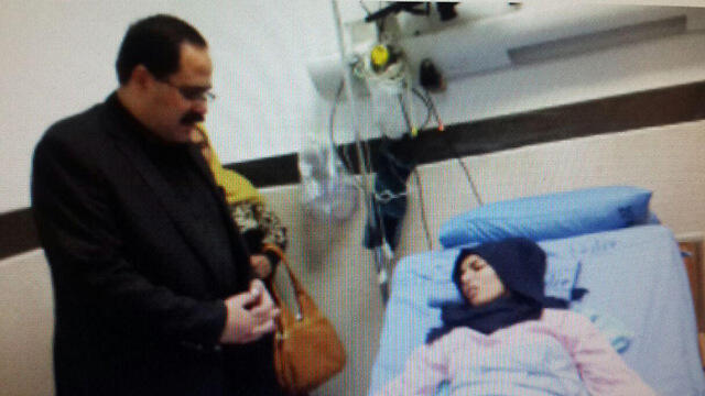 Raghad Khaddour at the hospital with Palestinian Minister of Education Dr. Sabri Saidam