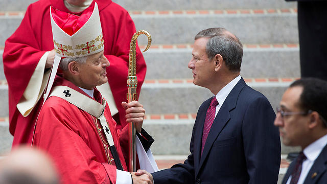 Chief Justice John Roberts shakes hands with Cardinal Donald Wuerl, archbishop of Washington, after attending the 64th Annual Red Mass at the Cathedral of St. Matthew the Apostle in Washington (Photo: Reuters) (Photo: Reuters) Chief Justice John Roberts shakes hands with Cardinal Donald Wuerl, archbishop of Washington, after attending the 64th Annual Red Mass at the Cathedral of St. Matthew the Apostle in Washington (Photo: Reuters)
