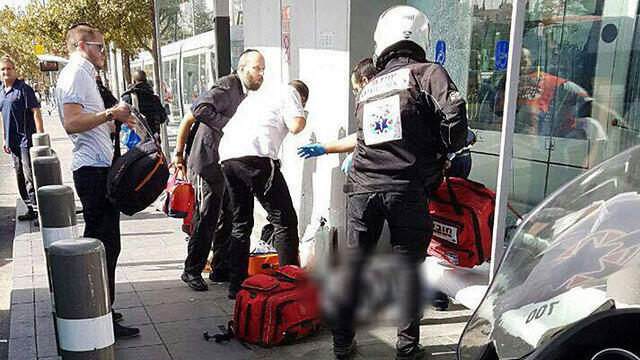 Paramedics treat victims at the scene