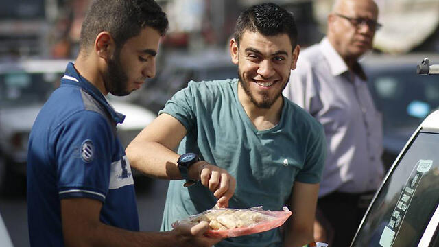 Gazans hand out sweets in celebration of the terrorist