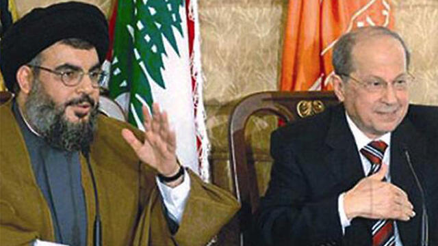 Aoun (R) and Nasrallah (File photo) 