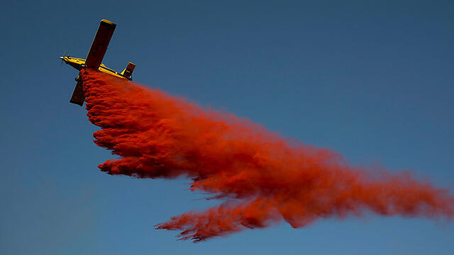 One of Israel's firefighting aircraft over the fire in Nataf (Photo: EPA)