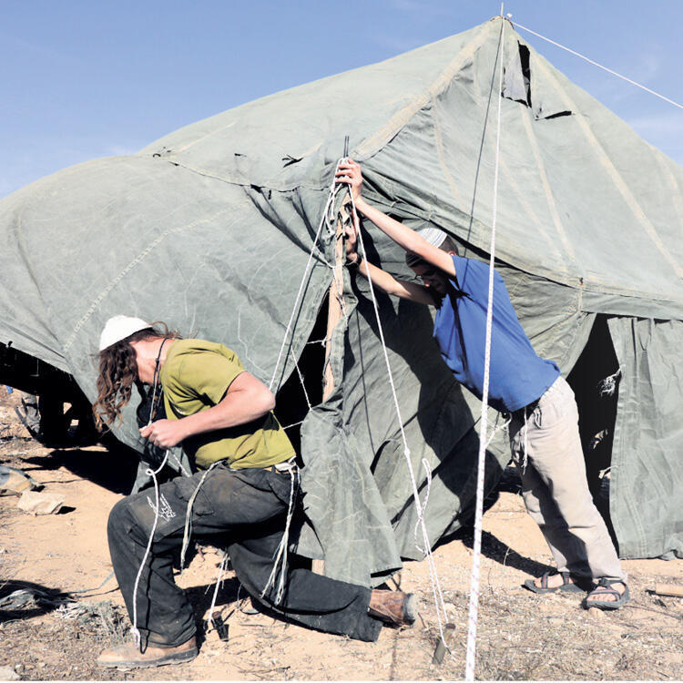 Raising tents in Amona.