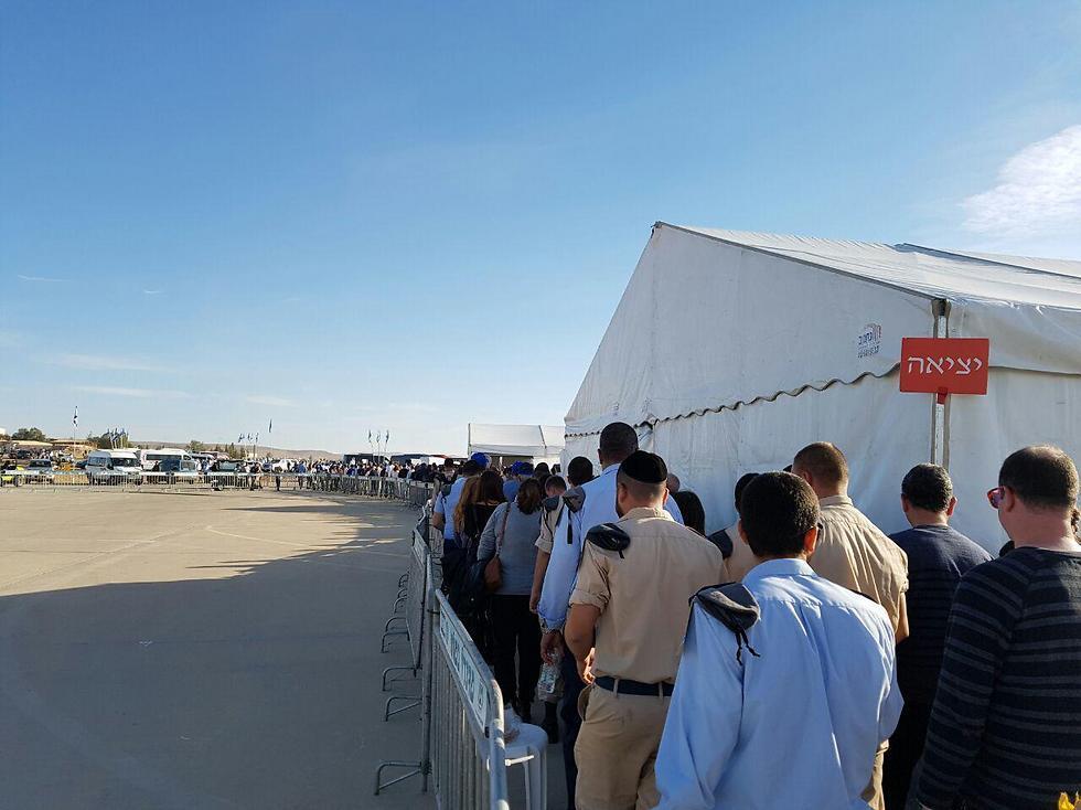 Spectators filing out after ceremony delayed (Photo: Yoav Zitun)