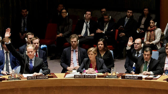 UK and Uruguay voting to adopt the resolution as the US abstains (Photo: EPA)