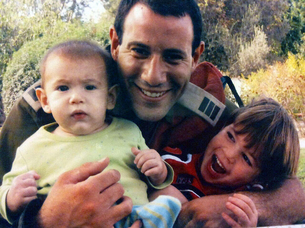 Ben-Ari with two of his children.nullnull Ben-Ari with two of his children.