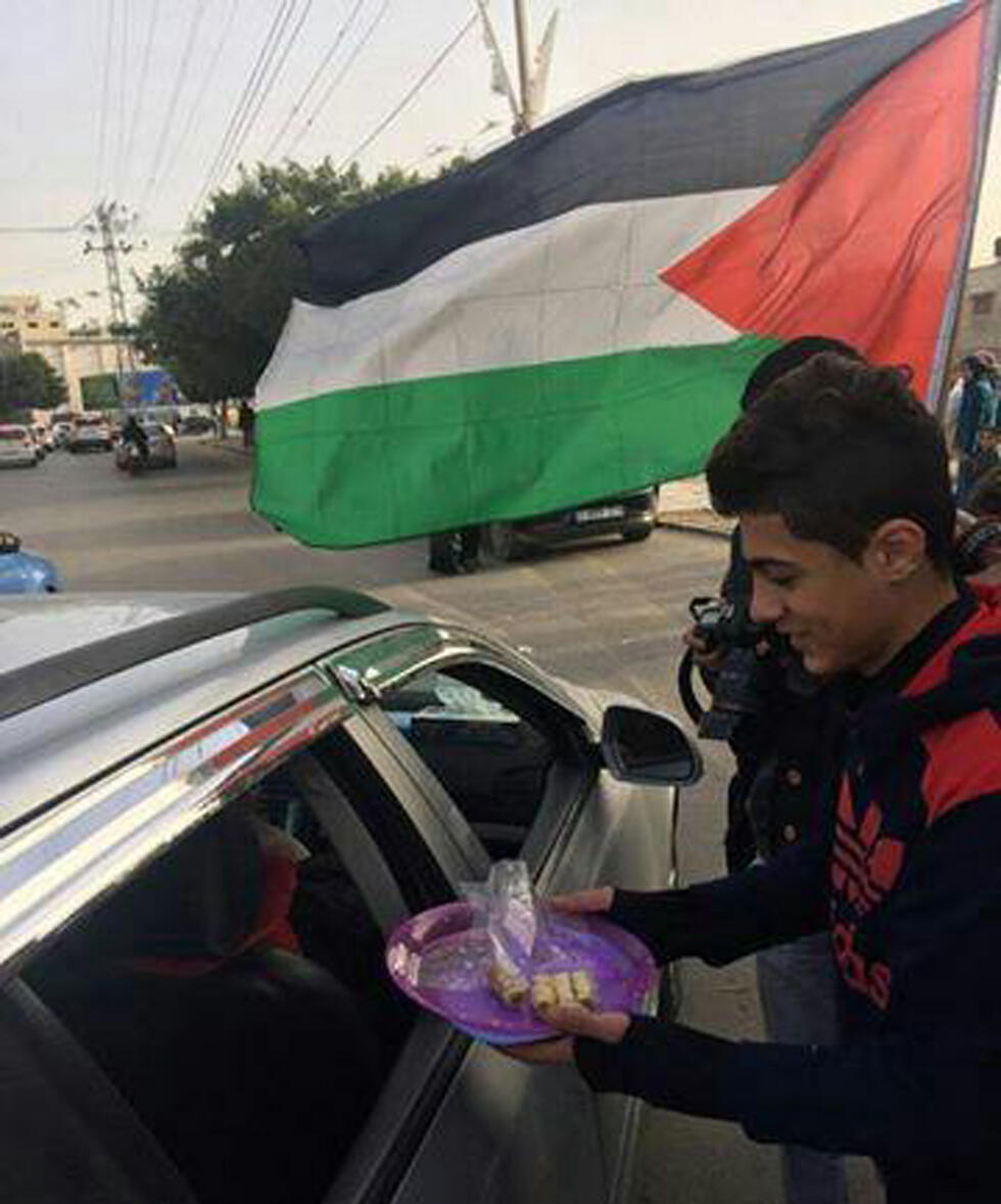 Distributing sweets in Gaza after the attack