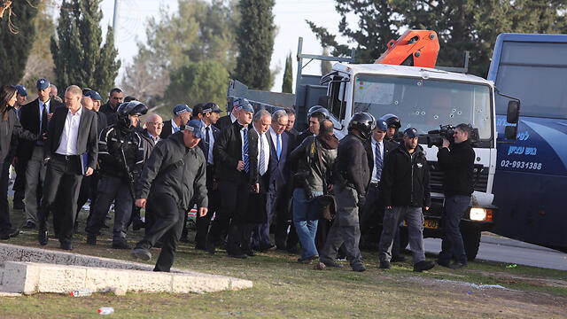 Lieberman and Netanyahu visit the site of the attack. (Photo: Gil Yohanan)