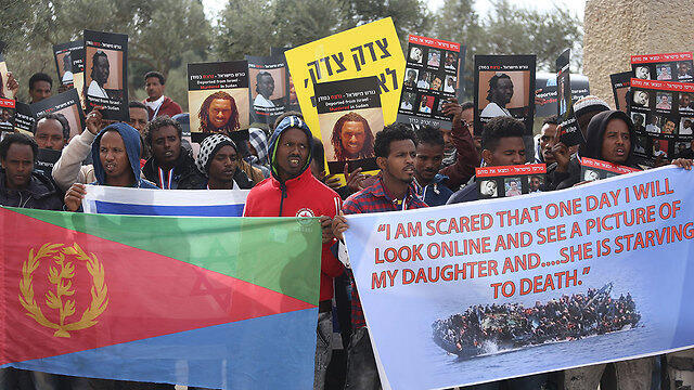 Protestors holding up signs of dead friends imploring to not get deported (Photo: Ohad Zwigenberg)