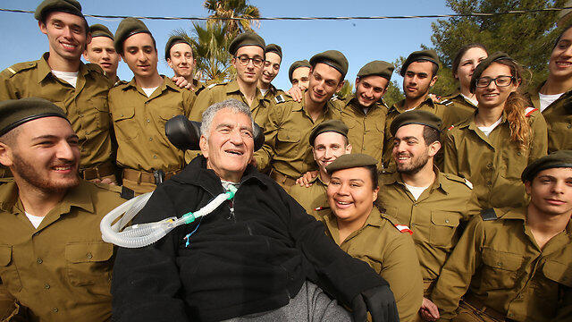 Levy with a group of the lone soldiers after the ceremony (Photo: Elad Gershgoren)nullnull Levy with a group of the lone soldiers after the ceremony (Photo: Elad Gershgoren)