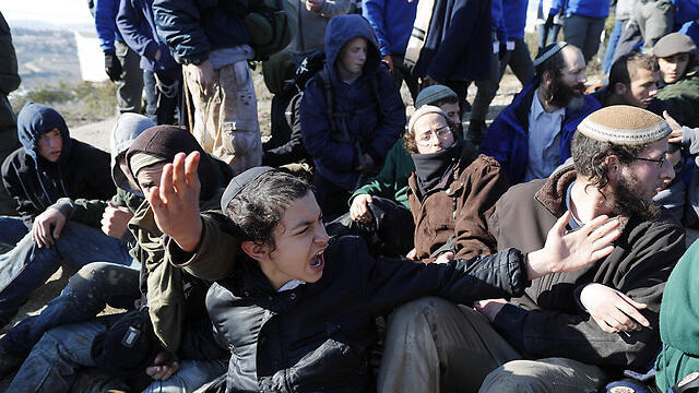 Protestors at Amona evacuation (Photo: AFP)
