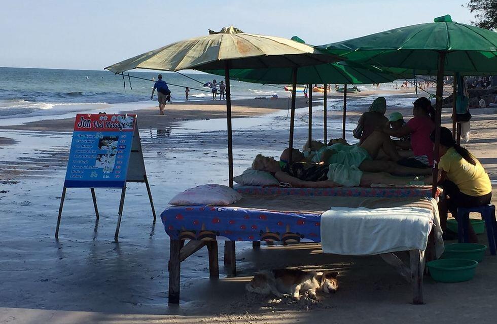Thai massage on the beach. That pup has the right idea! (Photo: Gaby Zohar)