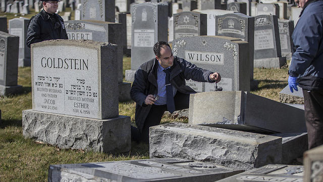 Detectives dusting for prints (Photo: AP)