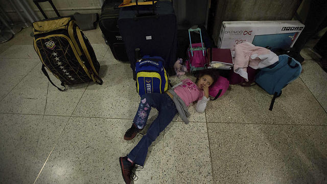 Hannah Perez waiting for her family at the airport (Photo: AP) (Photo: AP) Hannah Perez waiting for her family at the airport (Photo: AP)