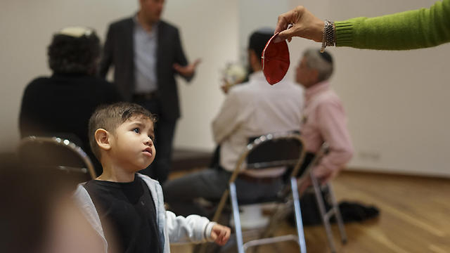 Ezra Perez, 3, handed a kippah at a synagogue in Bogota (Photo: AP) (Photo: AP) Ezra Perez, 3, handed a kippah at a synagogue in Bogota (Photo: AP)