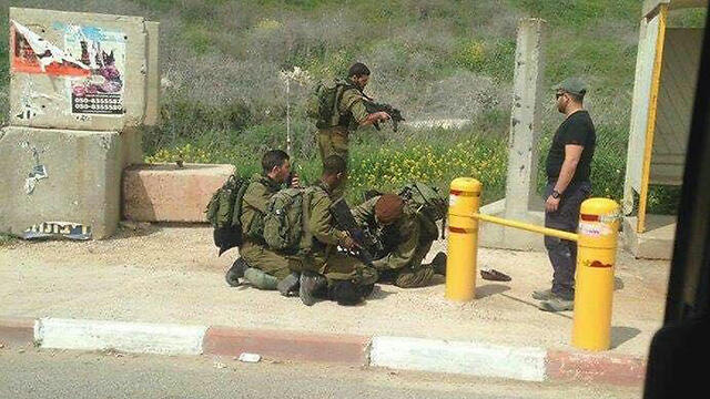 Soldiers overpowering the attackernullnull Soldiers overpowering the attacker