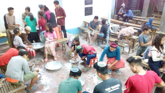 Members of the Bnei Menashe community preparing matzah for Passover at the Shavei Israel Hebrew Center in Churachandpur, India (Photo courtesy of Shavei Israel) (Photo courtesy of Shavei Israel) Members of the Bnei Menashe community preparing matzah for Passover at the Shavei Israel Hebrew Center in Churachandpur, India (Photo courtesy of Shavei Israel)