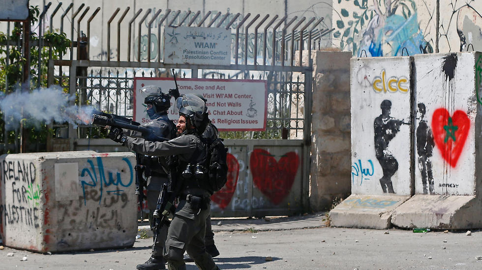 Israeli security forces fire tear gas towards Palestinian protesters during clashes following a demonstration in the West Bank town of Bethlehem. (Photo: AFP)