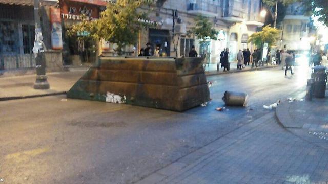 Overturned dumpsters in Mea Shearim